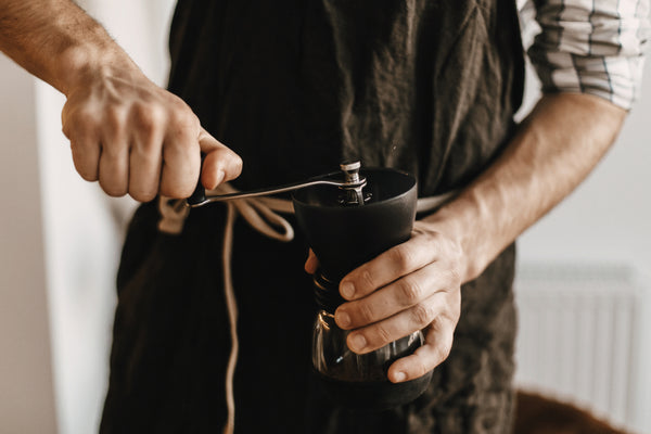 barista grinding coffee