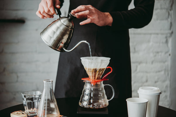 barista pouring coffee