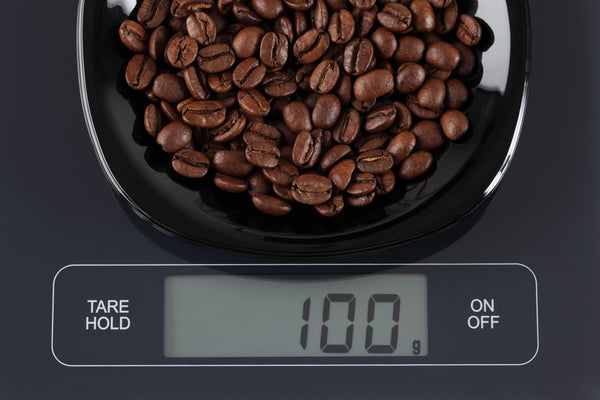 coffee beans on a weighing scale